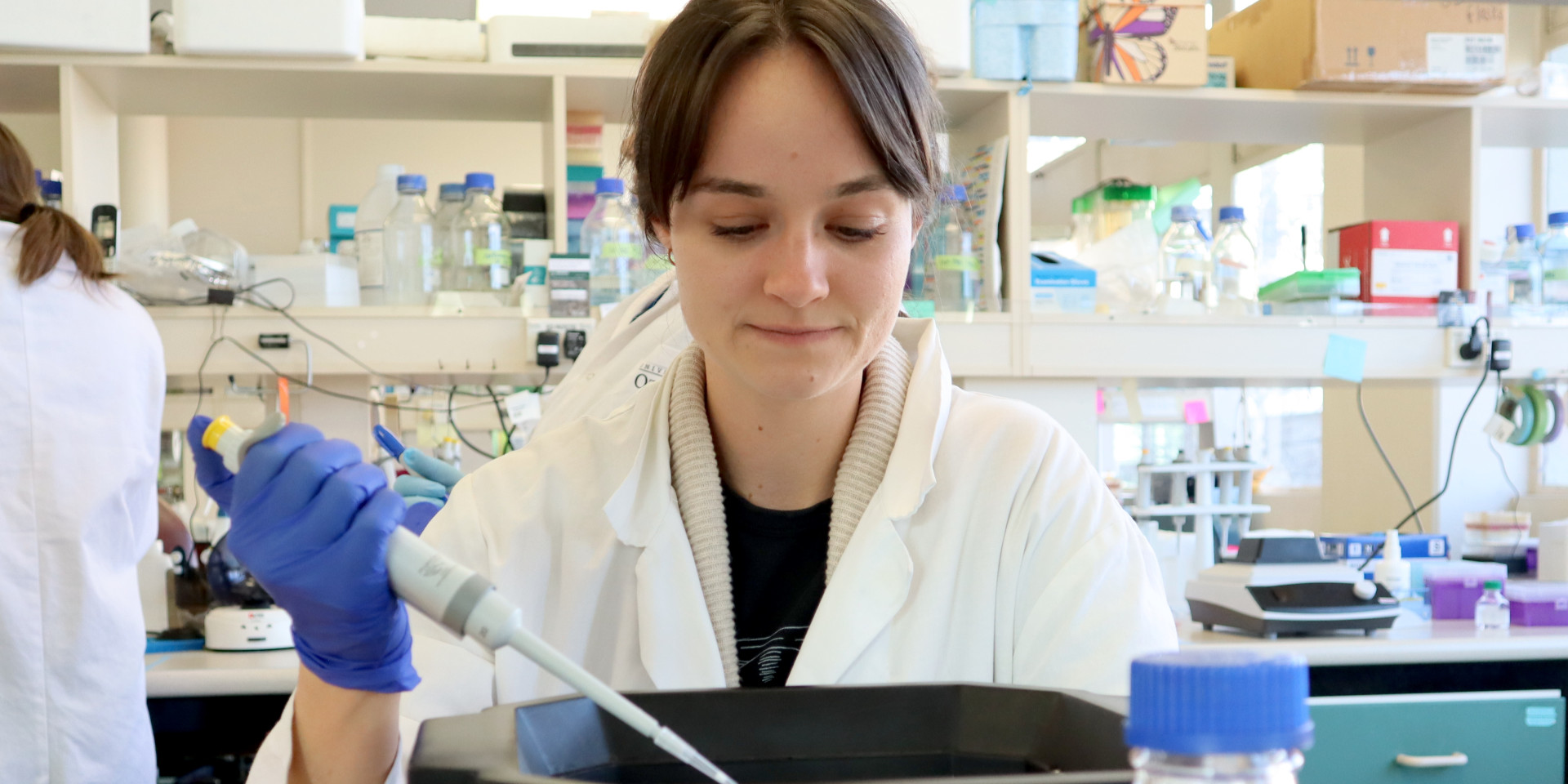 lab worker using a pipette - amaroq